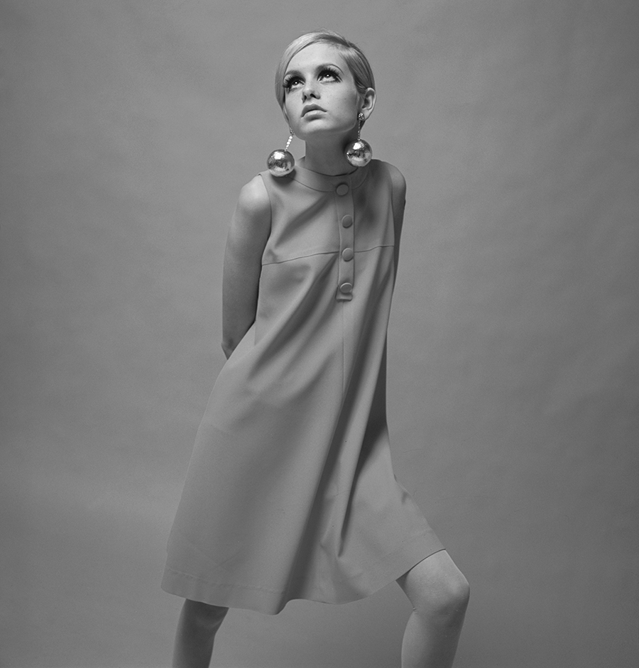 3rd December 1966. British Model Twiggy, (Lesley Hornby) is pictured wearing a pale pink mini dress.