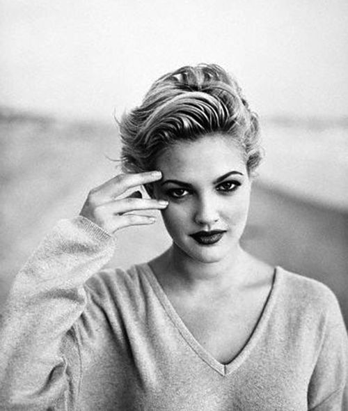 March 1993 --- Drew Barrymore Wearing a Sweater --- Image by © Jeffrey Thurnher/CORBIS OUTLINE